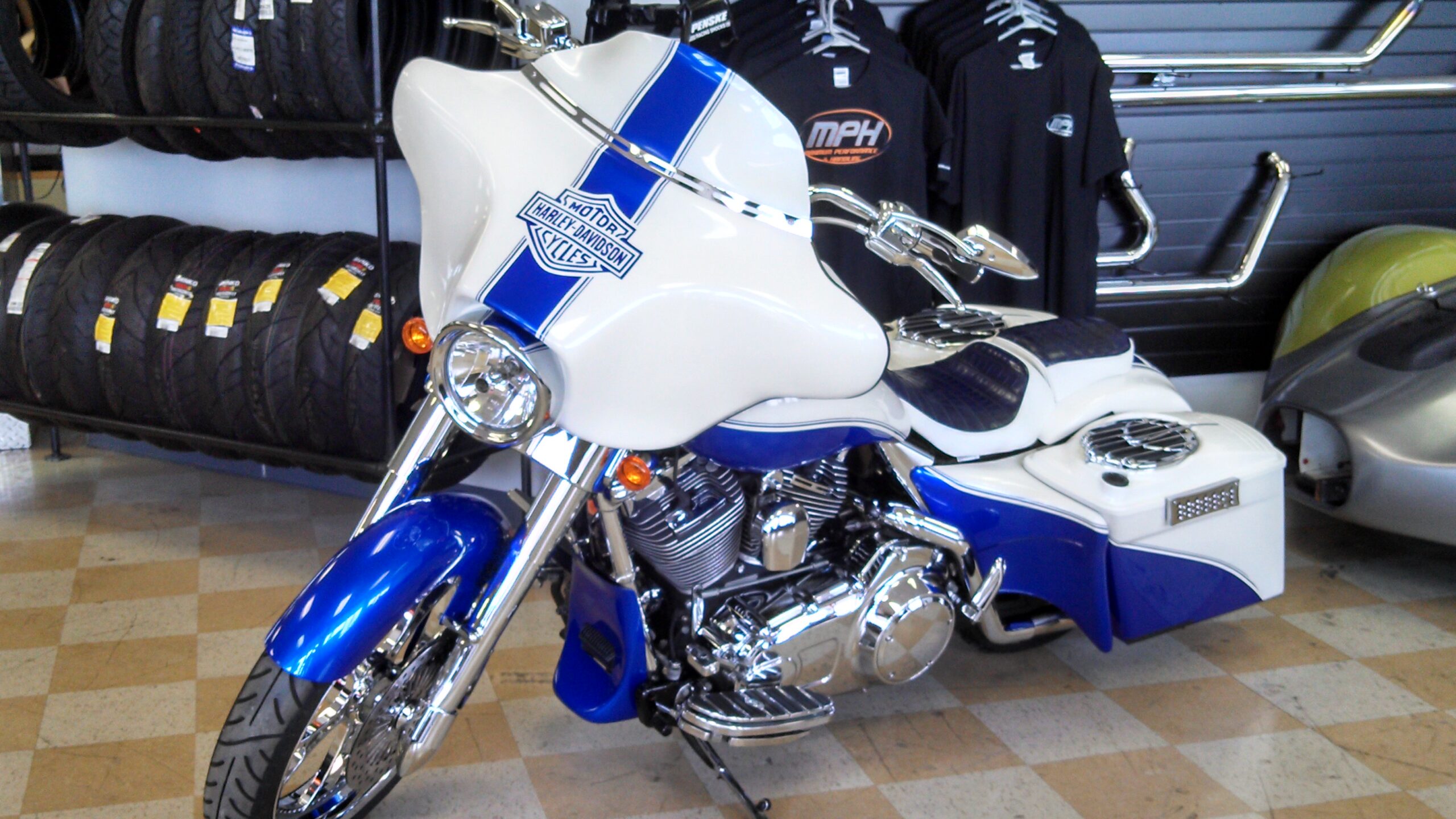A blue and white colored Motor Harley Davidson bike